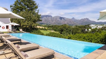 Outdoor pool, pool umbrellas, sun loungers
