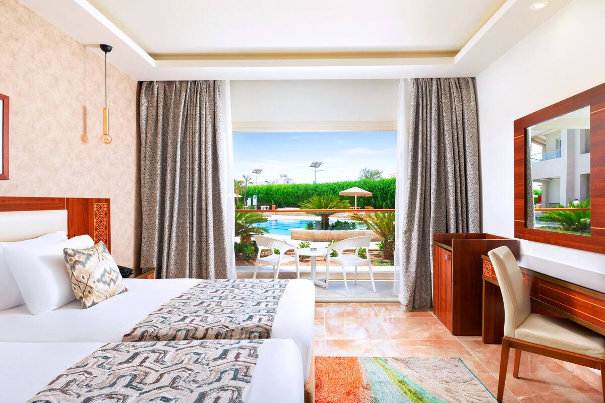 king suite with pool view | water view