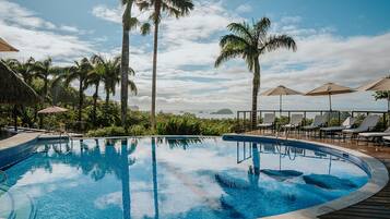 3 outdoor pools, open 7:00 AM to 7:00 PM, pool umbrellas, pool loungers