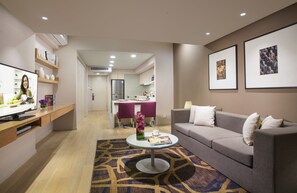 Two-Bedroom Executive | Living area | 29-inch LCD TV with satellite channels, TV, DVD player