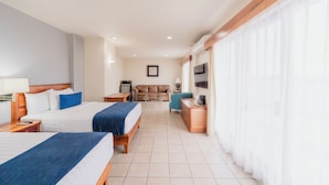 A hotel room with two beds, a sofa, a TV, and a desk. - Comfort Inn Tampico (Tampico)