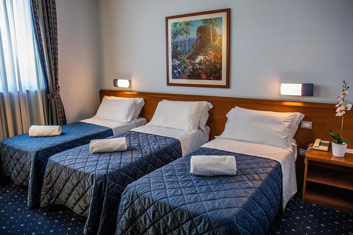 Triple Room | Down comforters, minibar, desk, blackout drapes