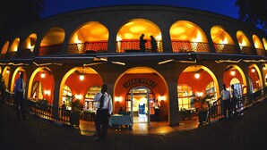A hotel with multiple arched windows and a central entrance labeled "SPIKE HOTEL". - Speke Hotel (Kampala)