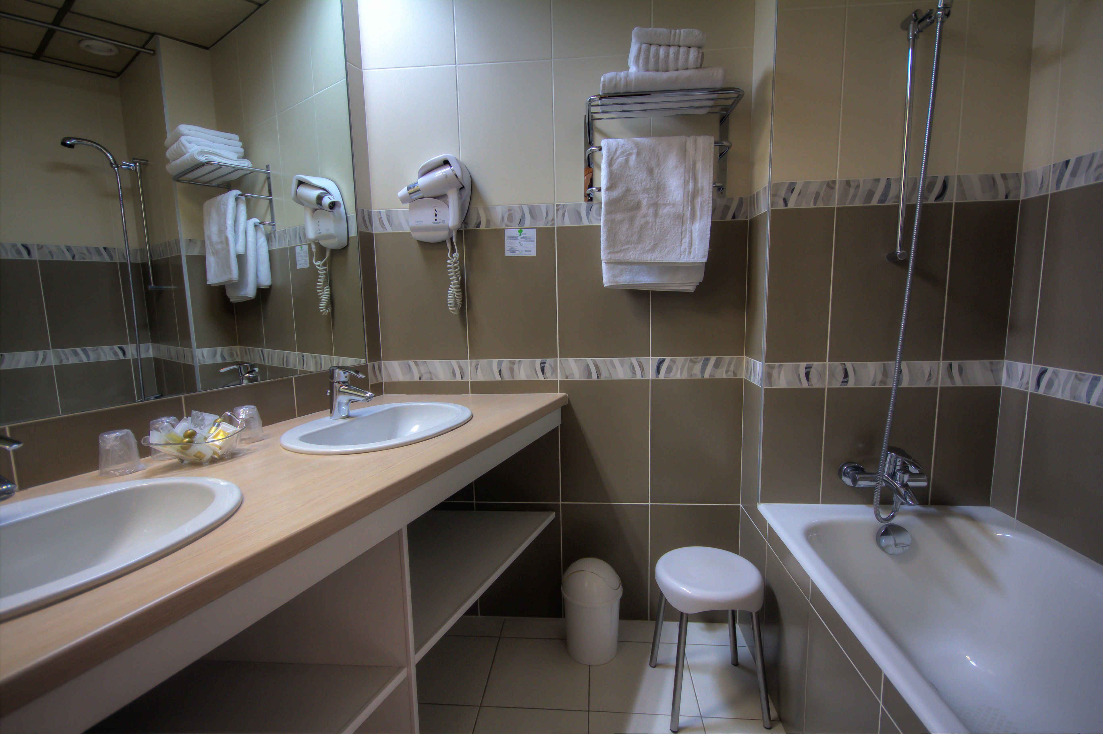 superior double room | bathroom | shower, hair dryer, towels