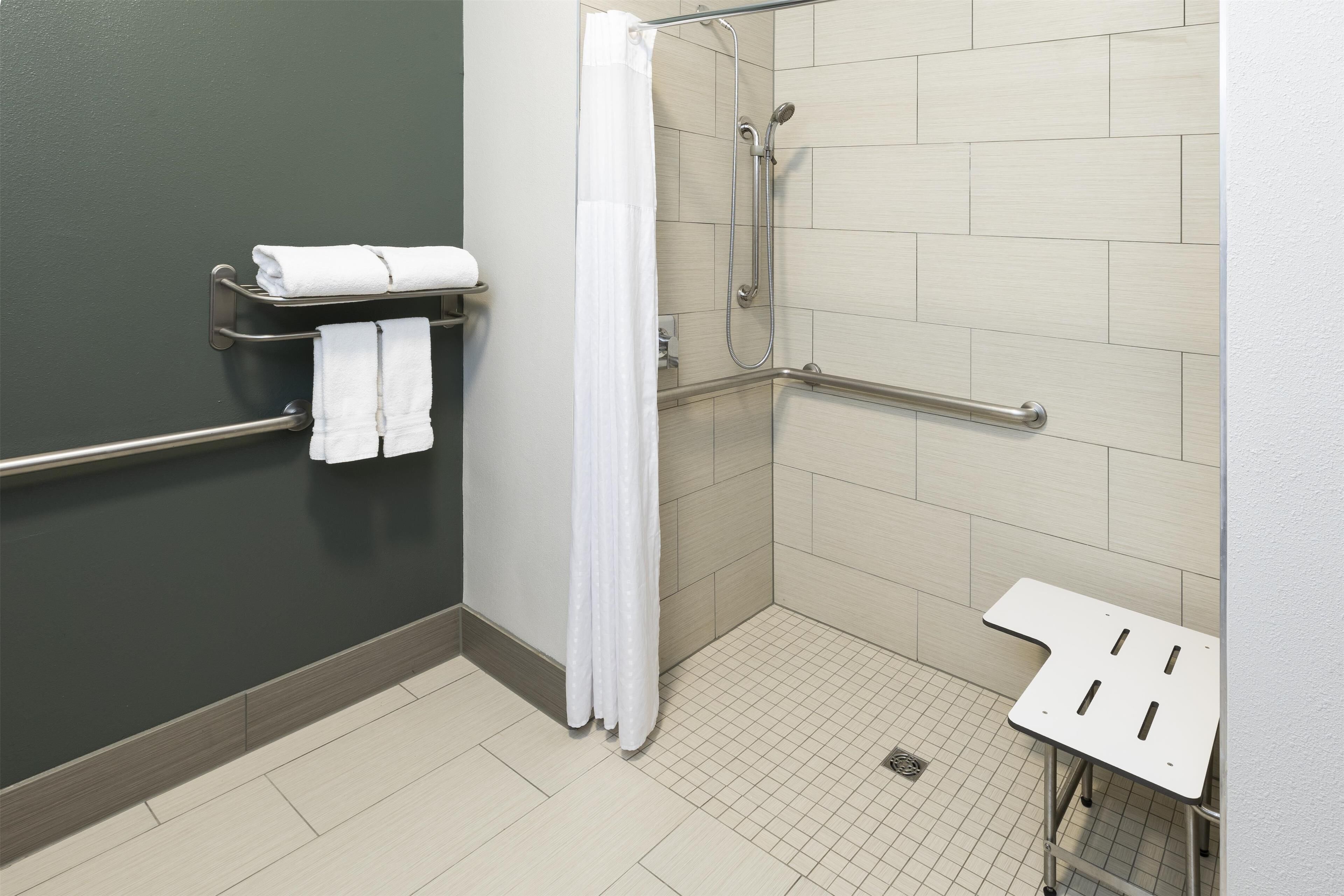 standard room, 1 king bed, accessible, non smoking | bathroom | designer toiletries, hair dryer, towels, soap