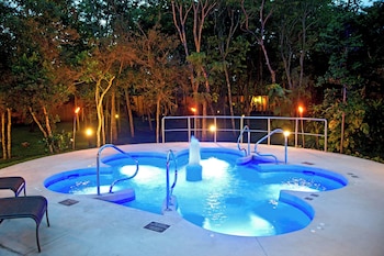 Outdoor pool, open 8:00 AM to 10:00 PM, pool umbrellas at Courtyard By Marriott Cancun Airport