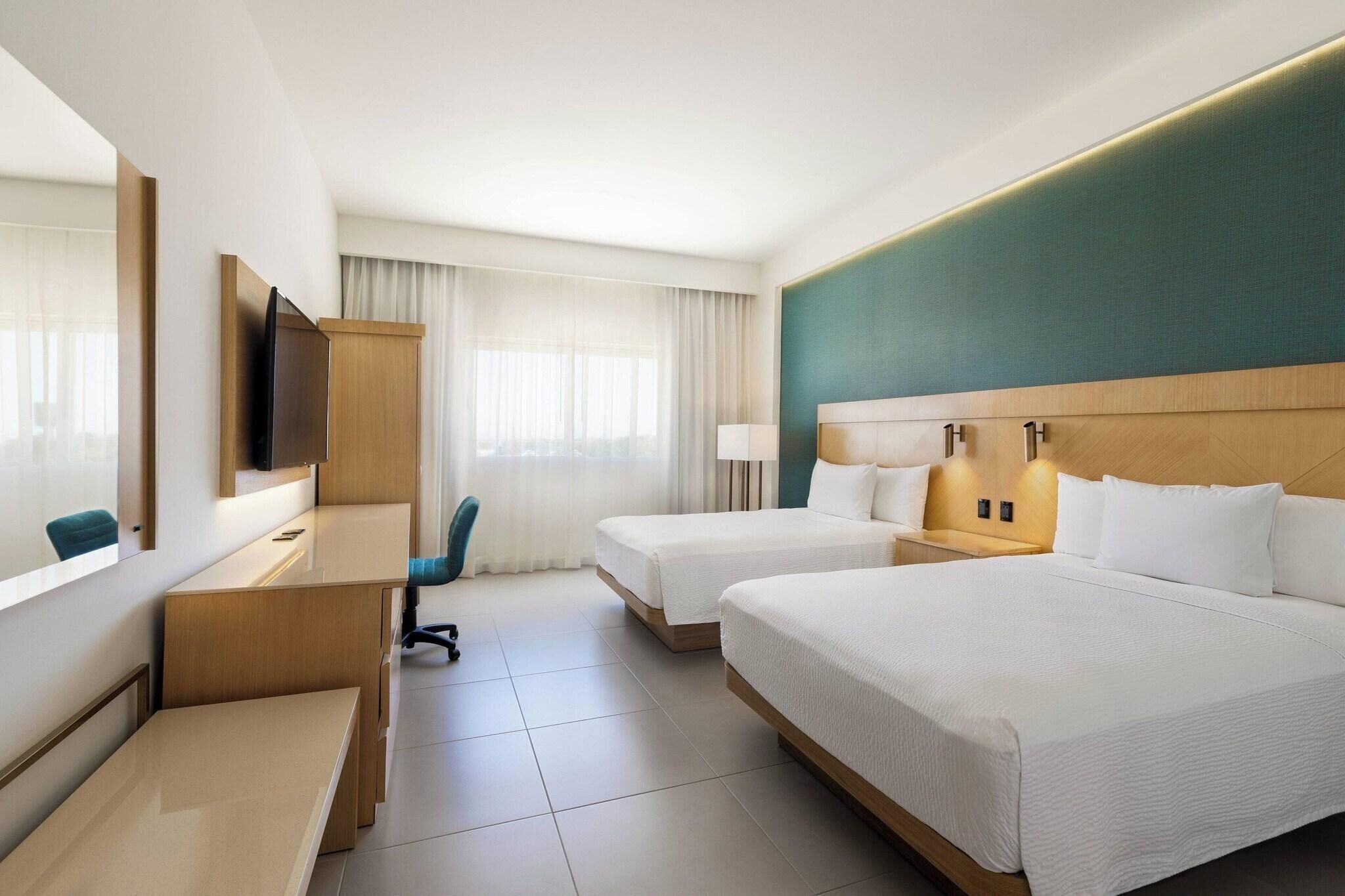 Premium bedding, down duvets, in-room safe, desk