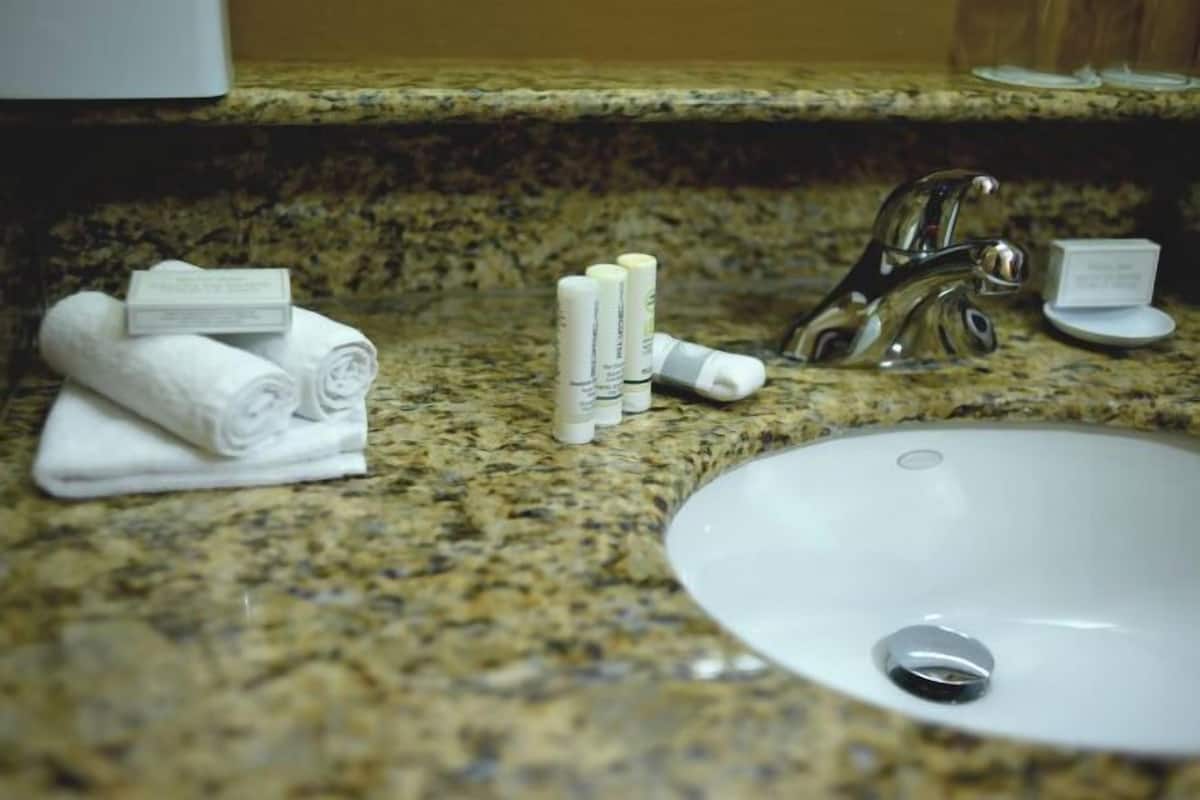 Designer toiletries, hair dryer, towels