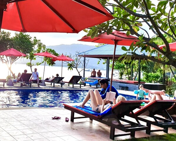 Outdoor pool, pool umbrellas, sun loungers
