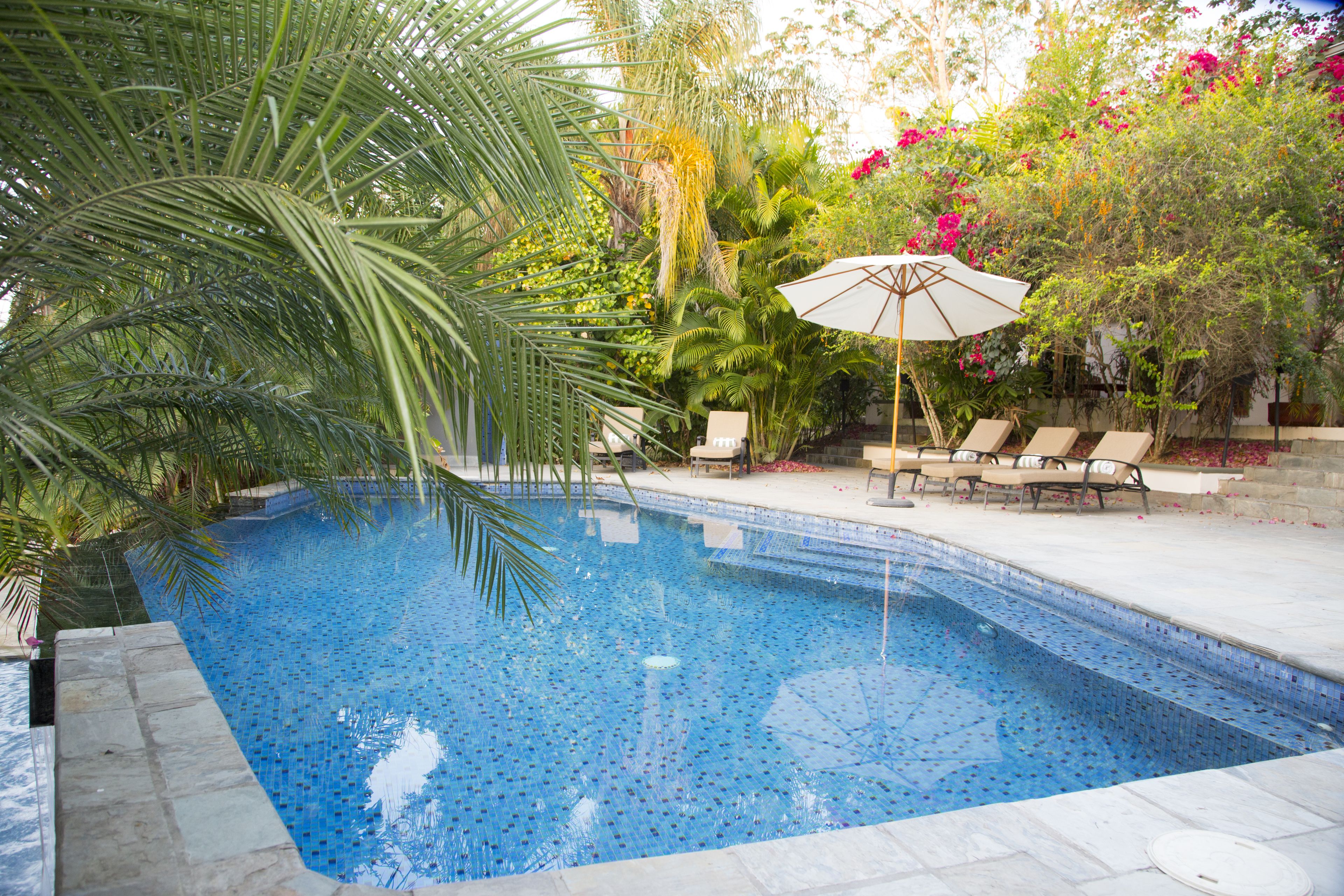 2 indoor pools, outdoor pool, open 7:00 AM to 7:00 PM, pool umbrellas
