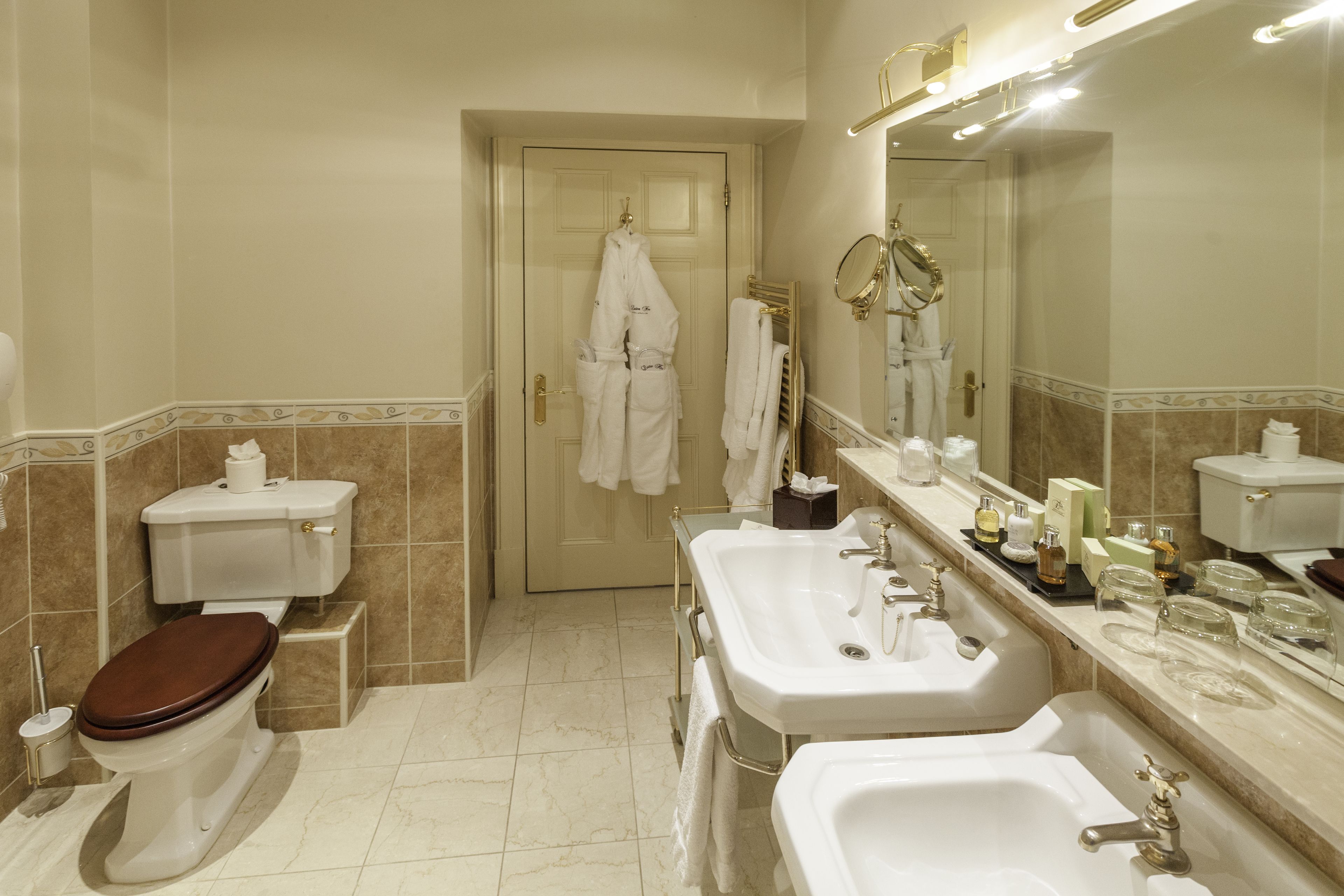 separate bathtub and shower, designer toiletries, hair dryer, bathrobes