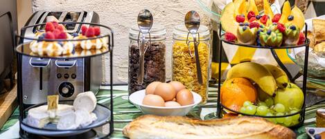 A breakfast buffet with various food items and a toaster.