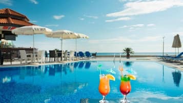 Seasonal outdoor pool, pool umbrellas, sun loungers