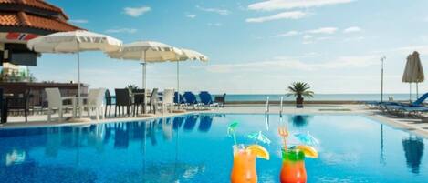 Seasonal outdoor pool, pool umbrellas, sun loungers