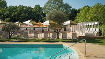 Indoor pool, seasonal outdoor pool, pool umbrellas, pool loungers