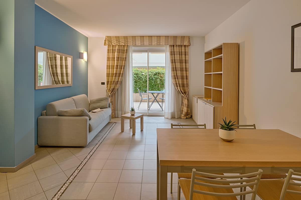 Apartment, 1 Bedroom | 1 bedroom, down comforters, in-room safe, desk