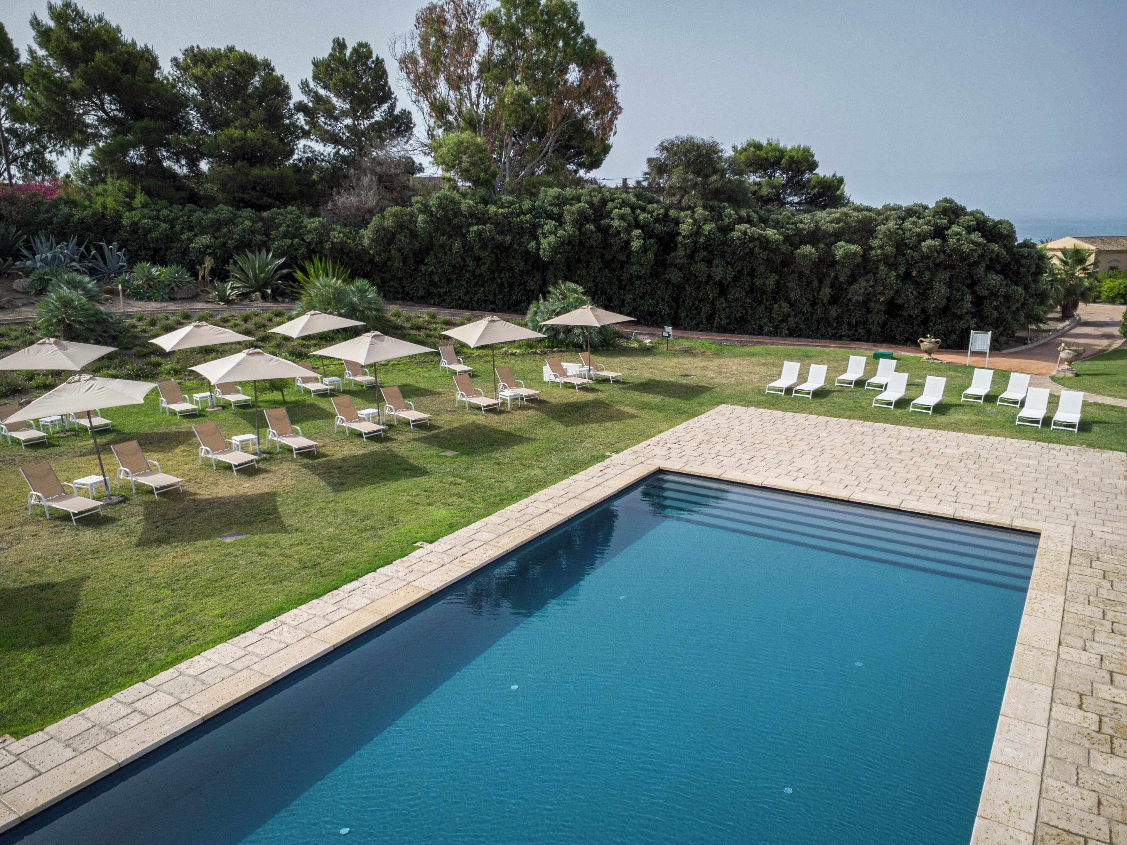 outdoor pool, pool umbrellas, pool loungers