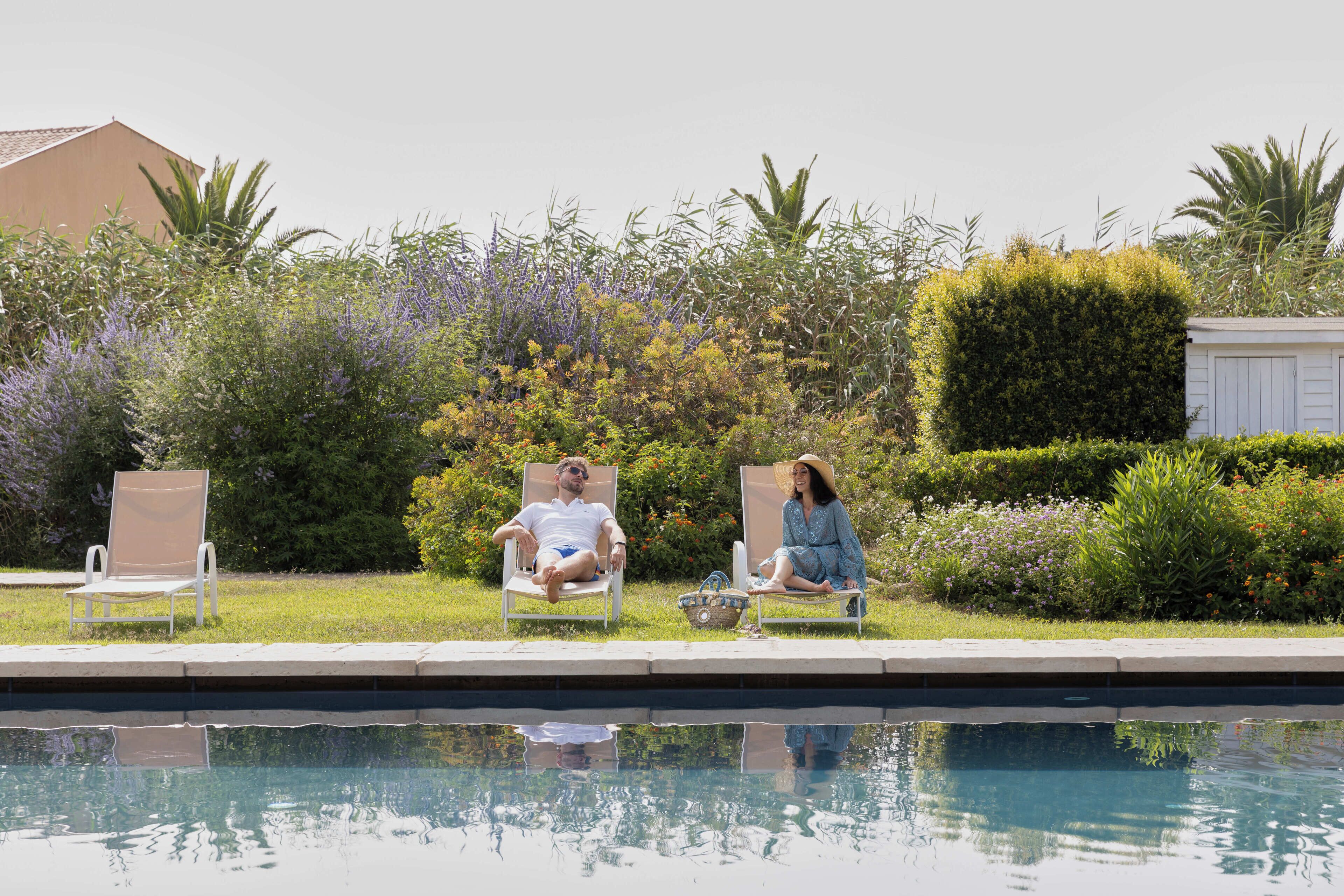 outdoor pool, pool umbrellas, pool loungers