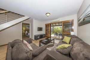 Flat-screen TV, DVD player, ping pong, pay films