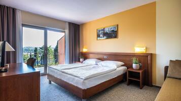 Habitación ejecutiva | Escritorio, cortinas opacas, wifi gratis y ropa de cama