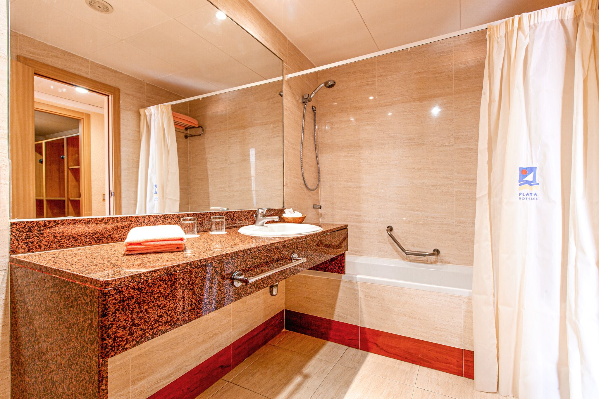 deep-soaking bathtub, eco-friendly toiletries, hair dryer, towels