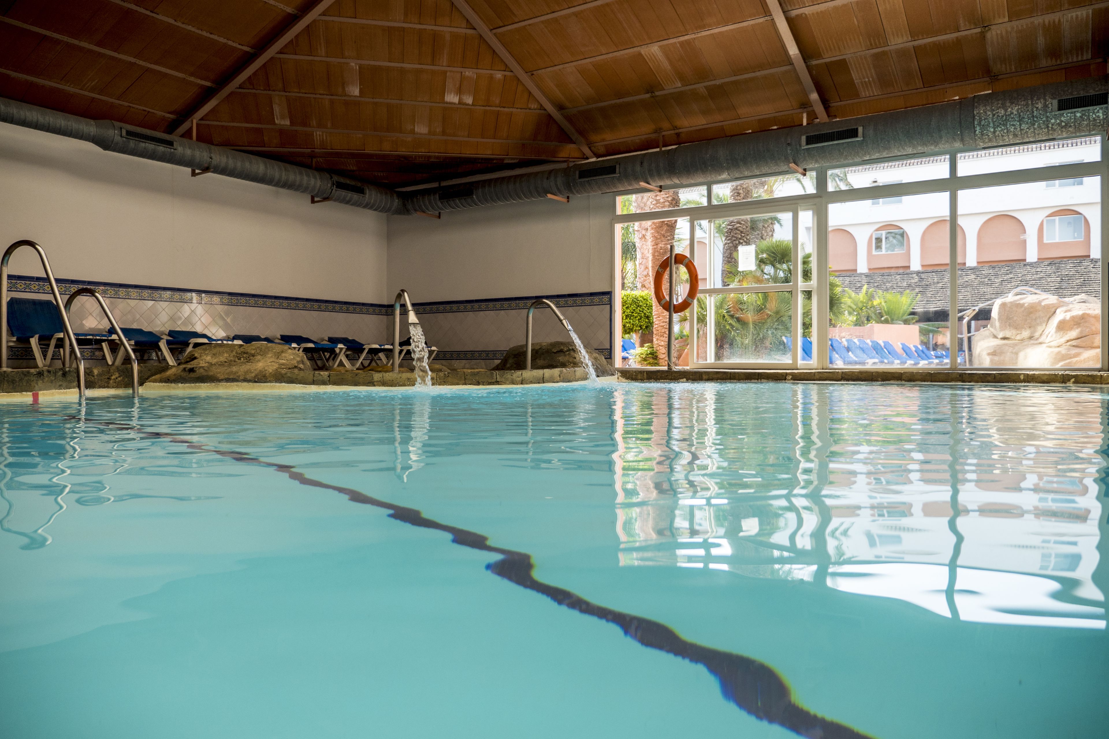 indoor pool, outdoor pool, pool loungers