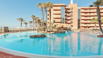 Indoor pool, outdoor pool, pool umbrellas, pool loungers
