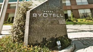 A tall, modern building with a glass facade and a sign reading "BYOTELL." - Byotell Istanbul (Istanbul)