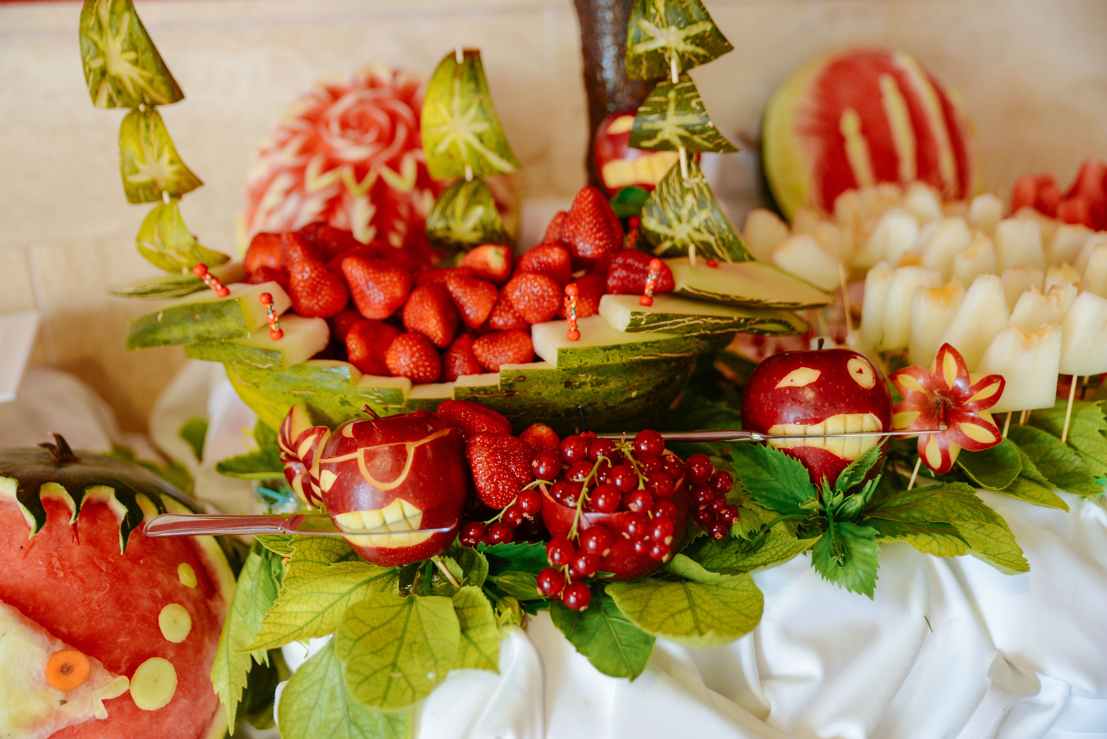A fruit and vegetable arrangement on a table.
