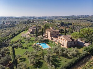 A large estate with multiple buildings, a swimming pool, and surrounding greenery. - Fattoria Querceto (Barberino Tavarnelle)