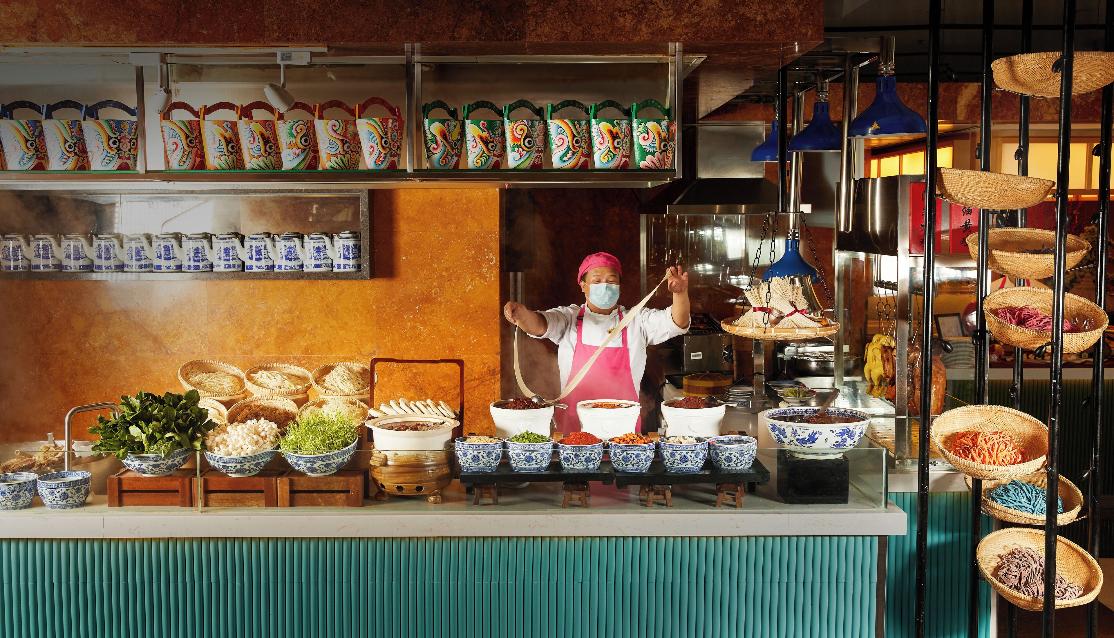 A food stall with various dishes and ingredients displayed.