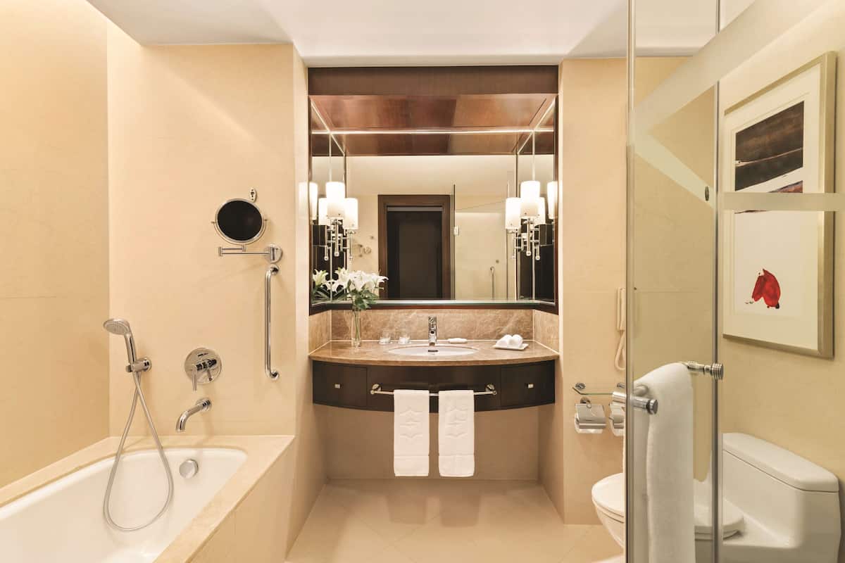 separate bathtub and shower, designer toiletries, hair dryer, bathrobes
