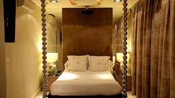 Egyptian cotton sheets, down comforters, Tempur-Pedic beds, minibar