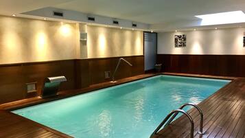 Indoor pool, open 10:00 AM to 9:00 PM, pool loungers