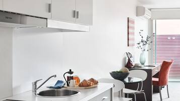 Fridge, microwave, stovetop, coffee/tea maker