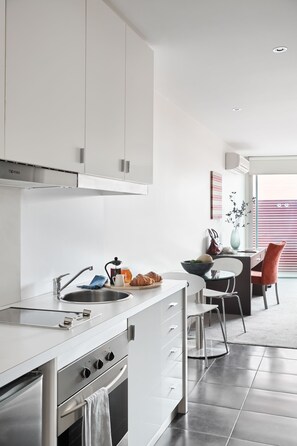 Fridge, microwave, stovetop, coffee/tea maker