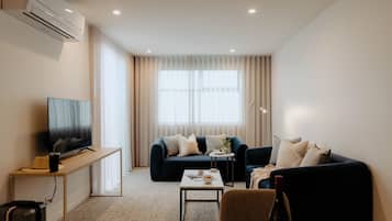 Three Bedroom Apartment - Adjoining | Living area | 32-inch LCD TV with cable channels, TV