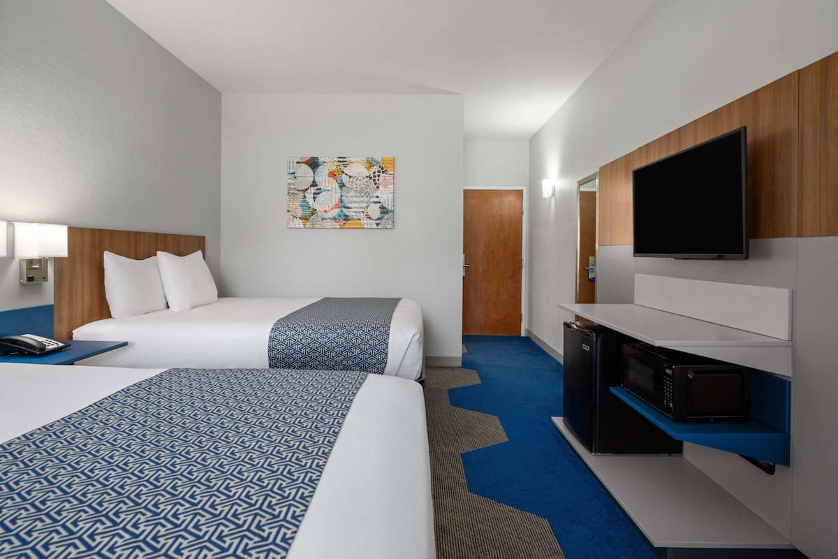 Standard Room, 2 Queen Beds | In-room safe, desk, iron/ironing board, free cribs/infant beds