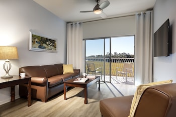 Two Bedroom Corner Suite with Terrace | Living area | 43-inch flat-screen TV with cable channels, TV, foosball at Melia Orlando Celebration