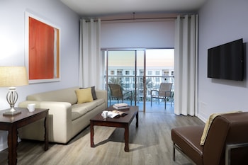 Two Bedroom, Family Suite | Living area | 43-inch flat-screen TV with cable channels, TV, foosball at Melia Orlando Celebration