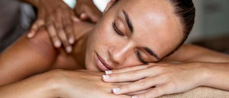 A person receiving a massage, indicating a spa or wellness facility.