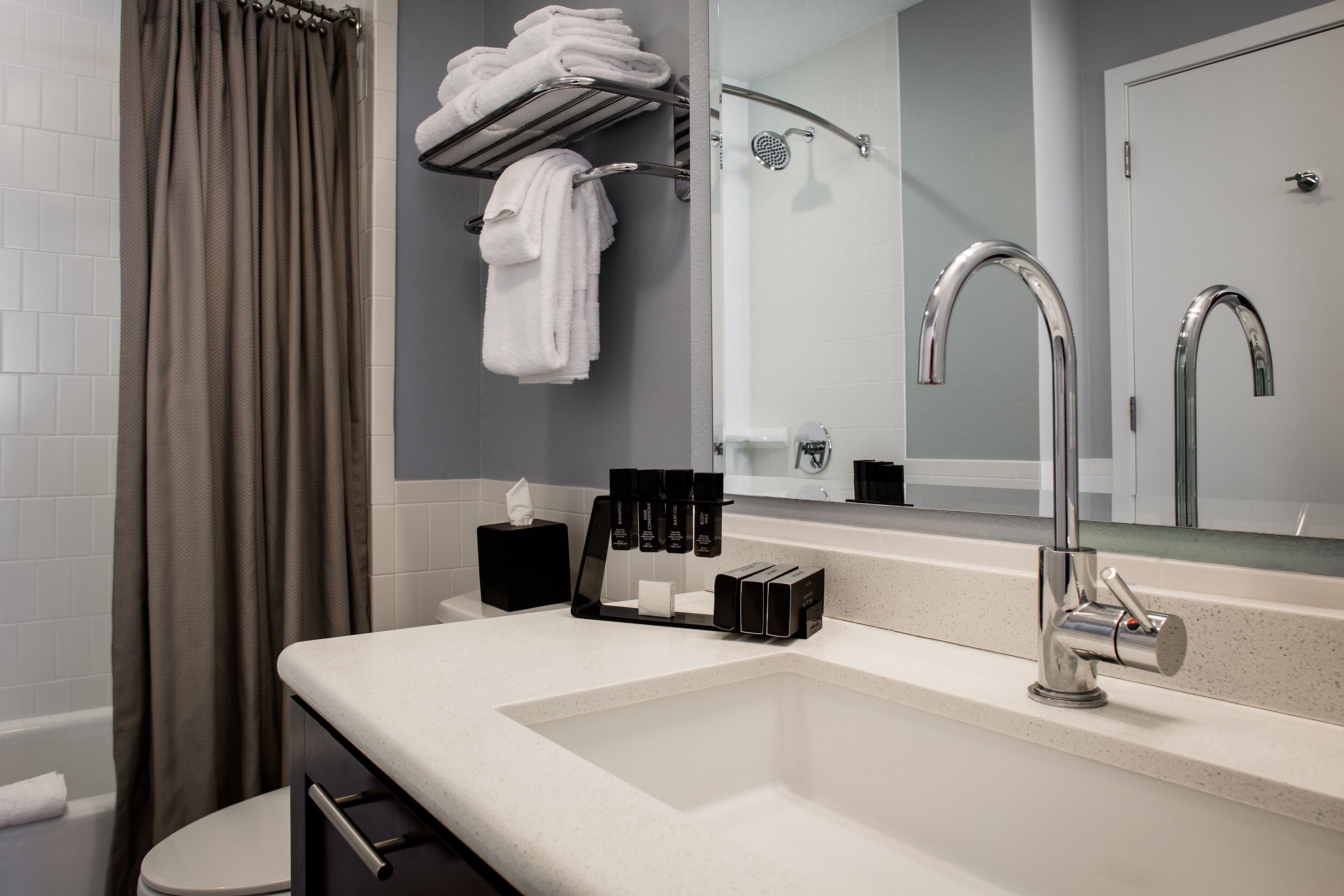 two bedroom, family suite | bathroom | shower, designer toiletries, hair dryer, towels