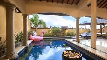 Relax by the tranquil pool, surrounded by columns and arches, and enjoy a refreshing dip.