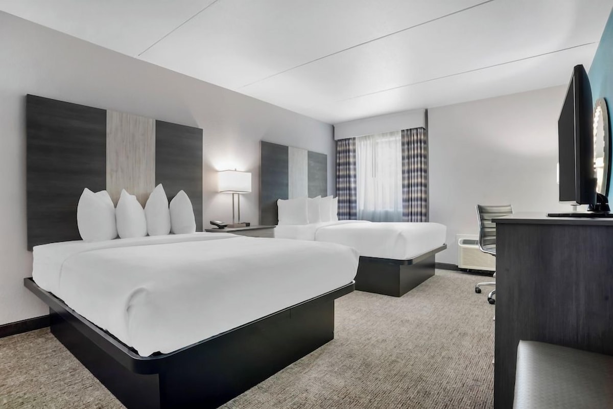 Premium bedding, pillow-top beds, desk, laptop workspace