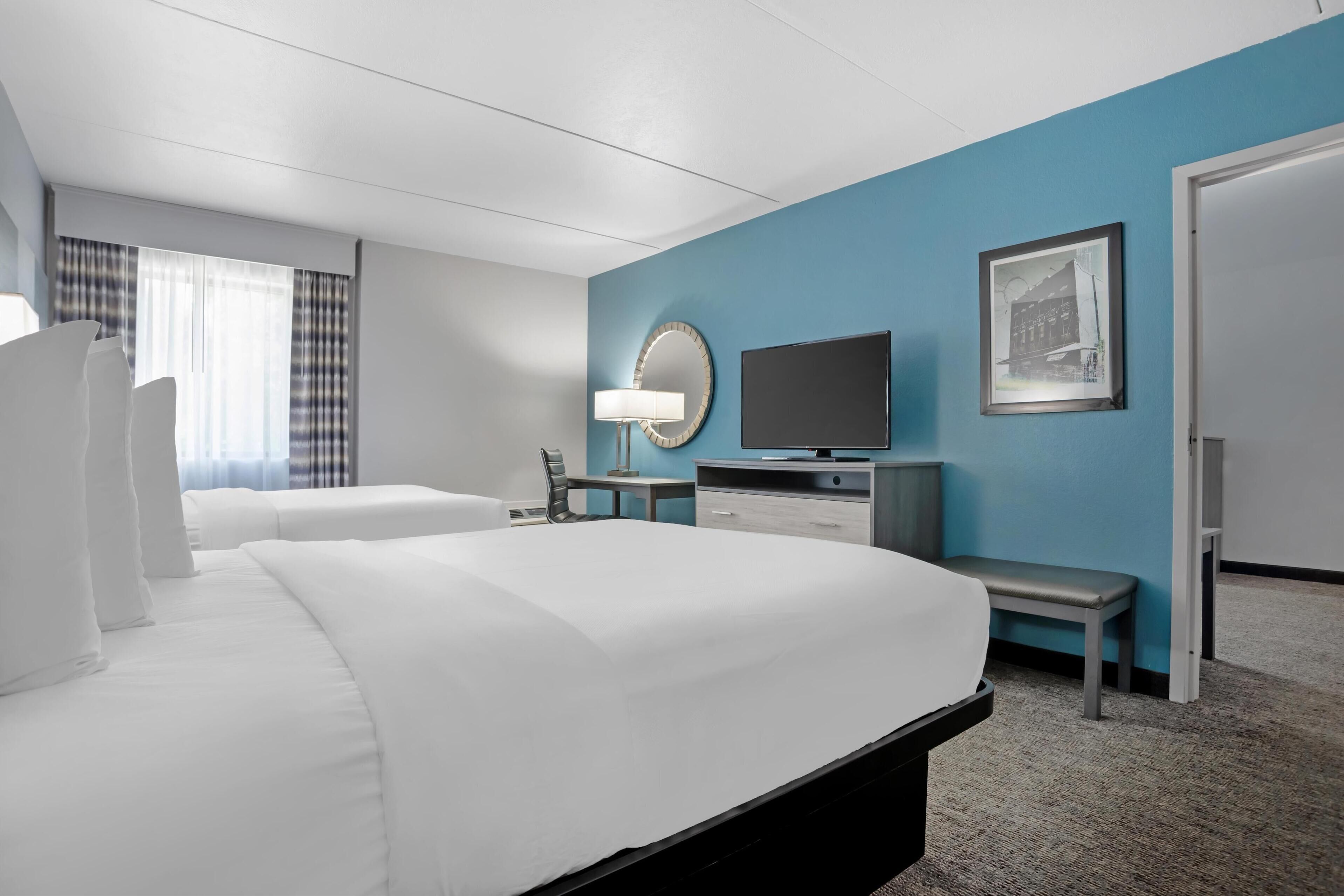 suite, 2 queen beds, non smoking, refrigerator & microwave (with sofabed) | 1 bedroom, pillow-top beds, individually decorated