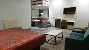 Room, 1 King Bed, Jetted Tub | Iron/ironing board, alarm clocks