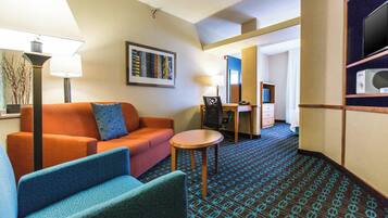 Suite, 1 King Bed with Sofa bed | Living area | 32-inch Smart TV with cable channels, TV, Netflix