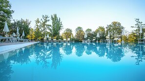 Seasonal outdoor pool, pool umbrellas, pool loungers