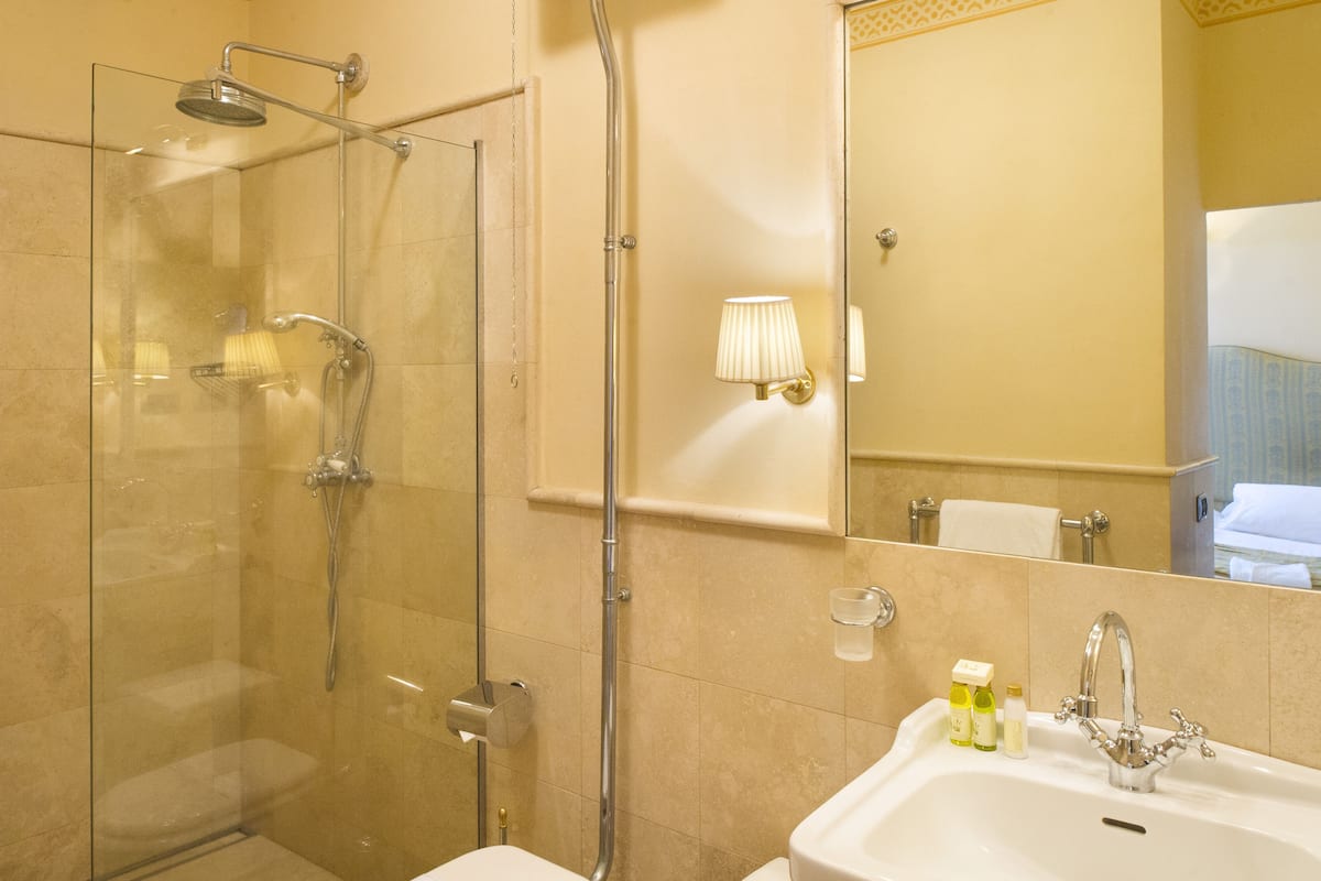 superior double room | bathroom | shower, rainfall showerhead, free toiletries, hair dryer