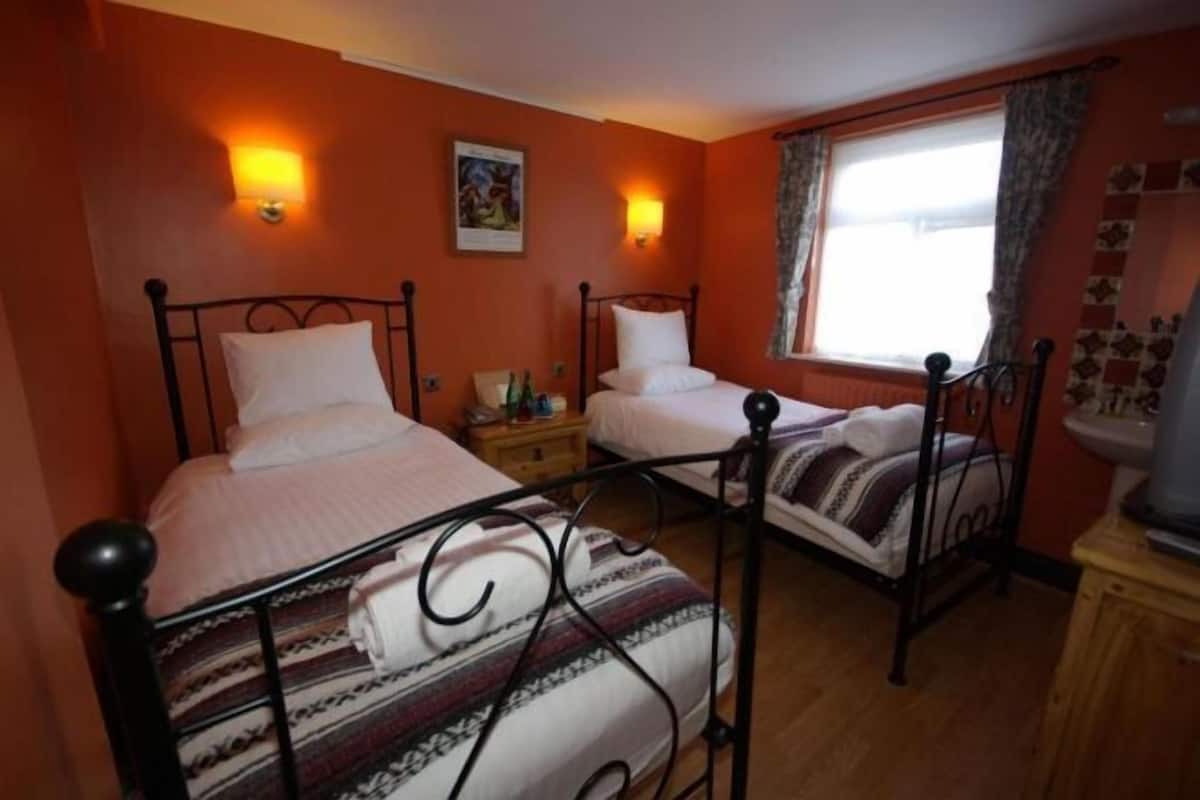 Premium bedding, desk, blackout drapes, iron/ironing board